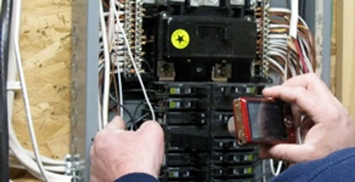 Home electrical inspection of circuit breaker panel by licensed electrician in Dayton, OH